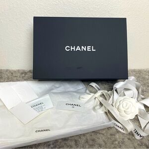 Chanel box, tissue, ribbon, flower